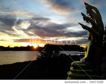 Buddha statue with beautiful natural morning sun. 54071090