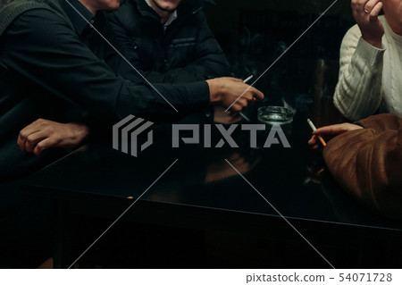 Smoking people using ashtray Smoking people using ashtray 54071728