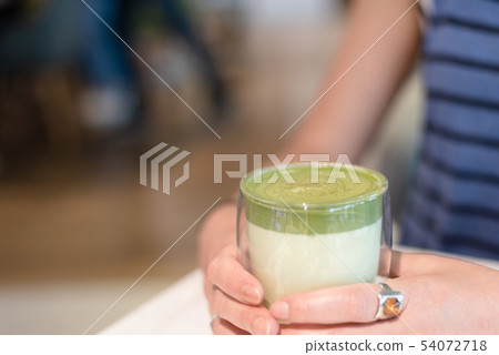 cup of matcha milk tea on table cup of matcha milk tea on table 54072718