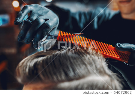 Stylish man sitting in a barbershop 54072962