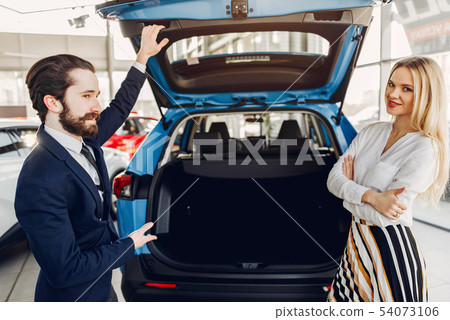 Stylish and elegant woman in a car salon 54073106