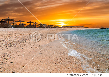 The beach with clear water in Egypt. Coast of the Red Sea. Summer holiday. The beach with clear water in Egypt. Coast of the Red Sea. Summer holiday. 54073499