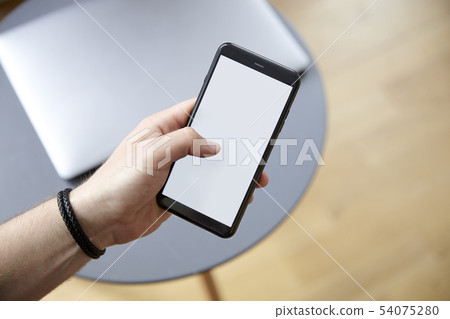 Left hand holding a mobile phone Left hand holding a mobile phone 54075280