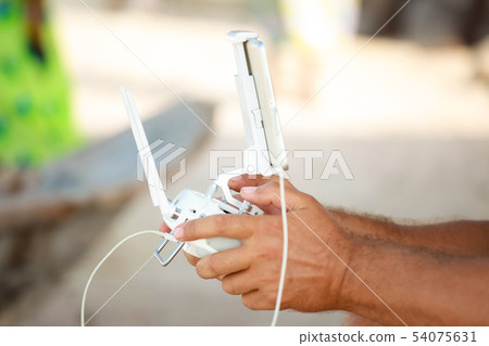 Remote control drone to hold men's hands Remote control drone to hold men's hands 54075631