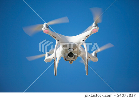 The drone hovered a blue sky background 54075837