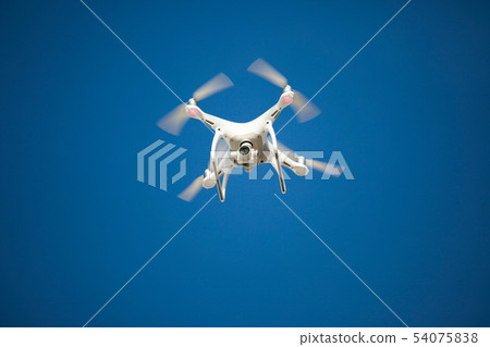 The drone hovered a blue sky background 54075838