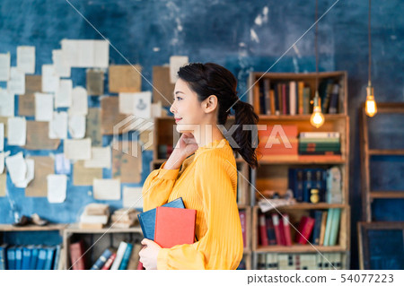 A woman with a book A woman with a book 54077223