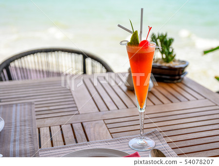 Mocktail mixed fruits with lime and cherry on 54078207