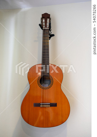 Acoustic guitar hanging decorative on wall 54078266