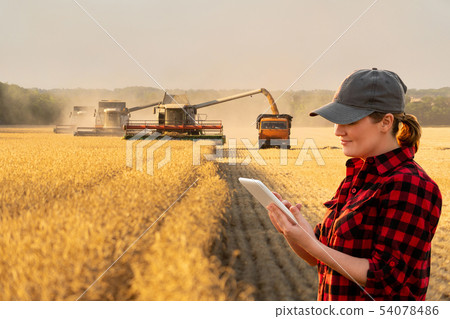 Woman farmer with digital tablet  54078486