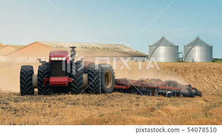 Autonomous tractor on the field Autonomous tractor on the field 54078510