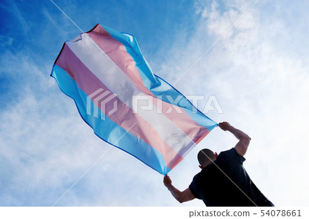 young person with a transgender pride flag 54078661