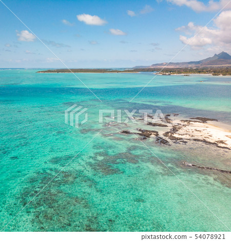 Aerial view of beautiful tropical beach with turquoise sea. Tropical vacation paradise destination 54078921