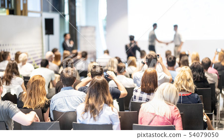 Businessmen shaking hands to seal a deal with his partner. Business and entrepreneurship award 54079050