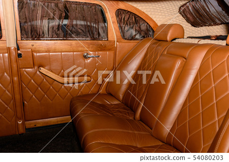 interior of the car is a brown color and leather interior of the car is a brown color and leather 54080203