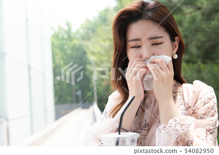 Woman with a sneezing nose cold toilet paper 54082950