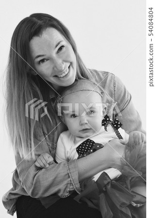baby in the arms of the mother. on white baby in the arms of the mother. on white 54084804