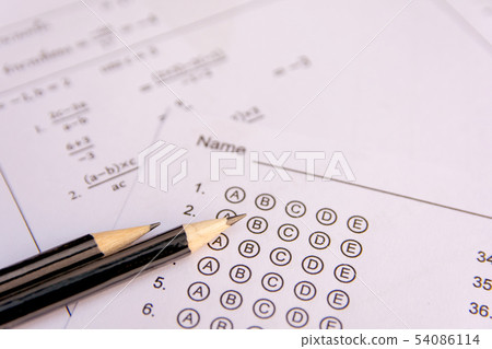 Pencil on answer sheets or Standardized test form Pencil on answer sheets or Standardized test form 54086114