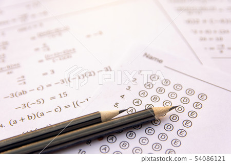 Pencil on answer sheets or Standardized test form Pencil on answer sheets or Standardized test form 54086121