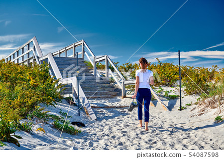 Woman walking to the beach, Ipswich, Woman walking to the beach, Ipswich, 54087598