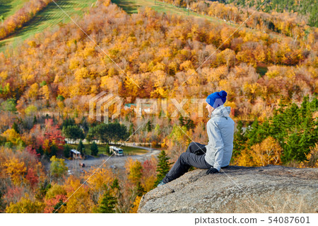 Woman hiking at Artist's Bluff in autumn Woman hiking at Artist's Bluff in autumn 54087601