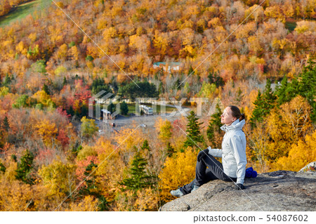 Woman hiking at Artist's Bluff in autumn Woman hiking at Artist's Bluff in autumn 54087602