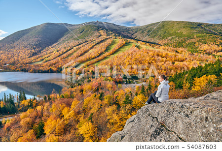 Woman hiking at Artist's Bluff in autumn 54087603