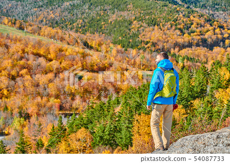 Backpacker man at Artist's Bluff in autumn Backpacker man at Artist's Bluff in autumn 54087733
