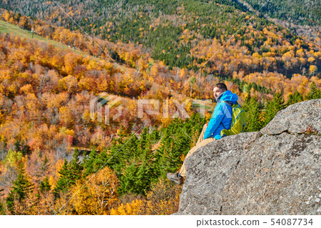 Backpacker man at Artist's Bluff in autumn Backpacker man at Artist's Bluff in autumn 54087734
