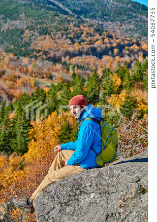 Backpacker man at Artist's Bluff in autumn Backpacker man at Artist's Bluff in autumn 54087735
