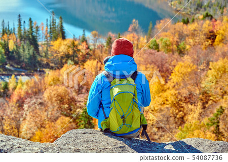 Backpacker man at Artist's Bluff in autumn Backpacker man at Artist's Bluff in autumn 54087736