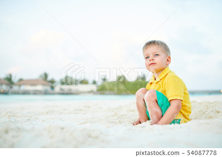 Three year old toddler boy on beach Three year old toddler boy on beach 54087778
