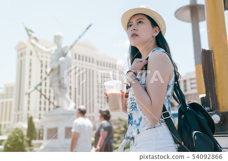 traveler sightseeing statue in background traveler sightseeing statue in background 54092866