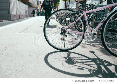 bicycle classic with seats at sidewalk bicycle classic with seats at sidewalk 54092868