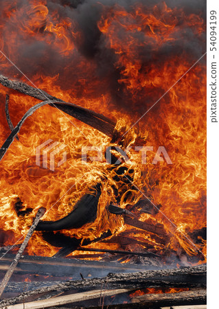 Burning automobile wheels, flame of red fire Burning automobile wheels, flame of red fire 54094199