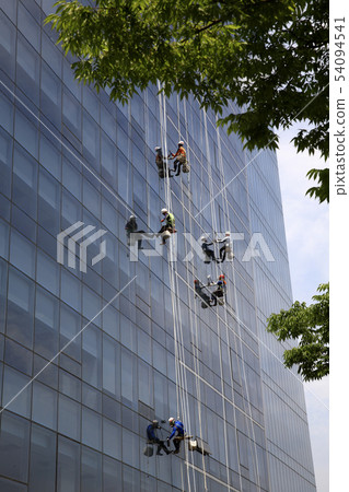 Skyscraper glass wall cleaning Skyscraper glass wall cleaning 54094541