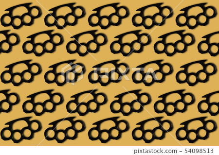 Brass knuckles on a yellow background. Creative Brass knuckles on a yellow background. Creative 54098513