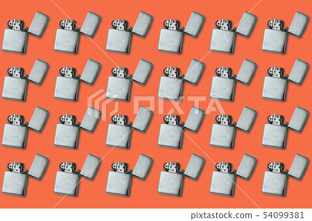 Gasoline lighter, metal lighter on a yellow 54099381