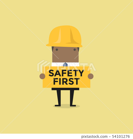 African businessman holding safety first sign. African businessman holding safety first sign. 54101276