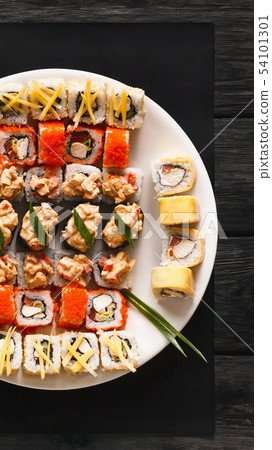 Set of sushi for two with chopsticks on rustic wood background 54101301