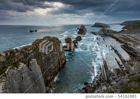 Dramatic view of Playa de la Arnia, Cantabria, Spain. 54102985