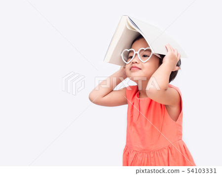 little cute girl wear glasses and book on head little cute girl wear glasses and book on head 54103331