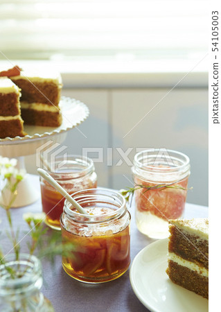 Fruit jam and cake in a glass bottle Fruit jam and cake in a glass bottle 54105003