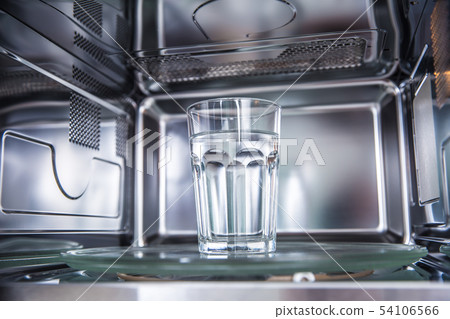 Inside view of new clean staniless, microwave oven Inside view of new clean staniless, microwave oven 54106566