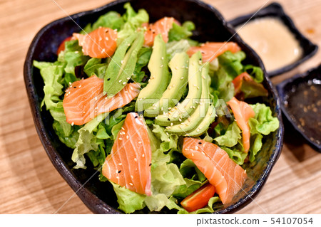 Salmon and avocado salad with fresh organic. 54107054