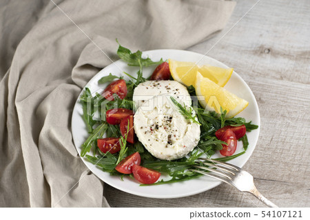 Mozzarella salad with arugula Mozzarella salad with arugula 54107121