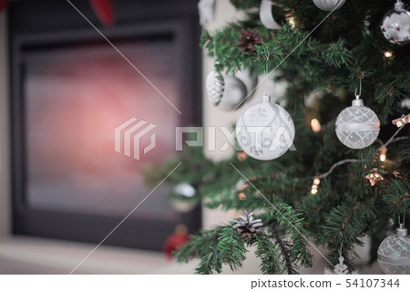 Fireplace decorated for Christmas holidays Fireplace decorated for Christmas holidays 54107344