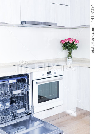 Dishwasher and beautiful bouquet of flowers in Dishwasher and beautiful bouquet of flowers in 54107354