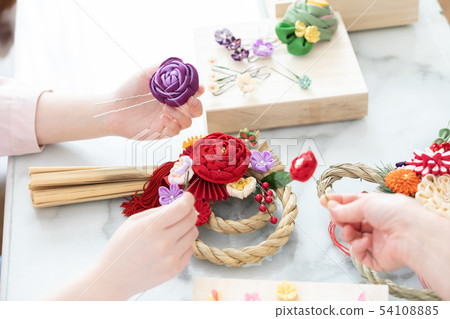 Woman hand making New Year decorations 54108885