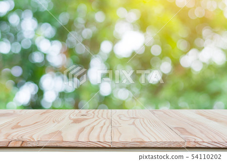 Empty wood table top and blur nature background Empty wood table top and blur nature background 54110202